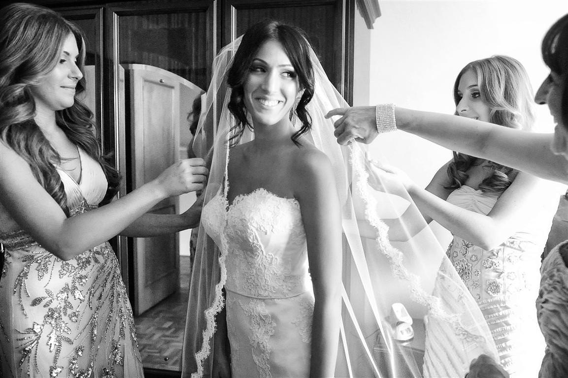 astonishing wedding getting ready bride with bridesmaids around black white wedding photo by lavimage montreal