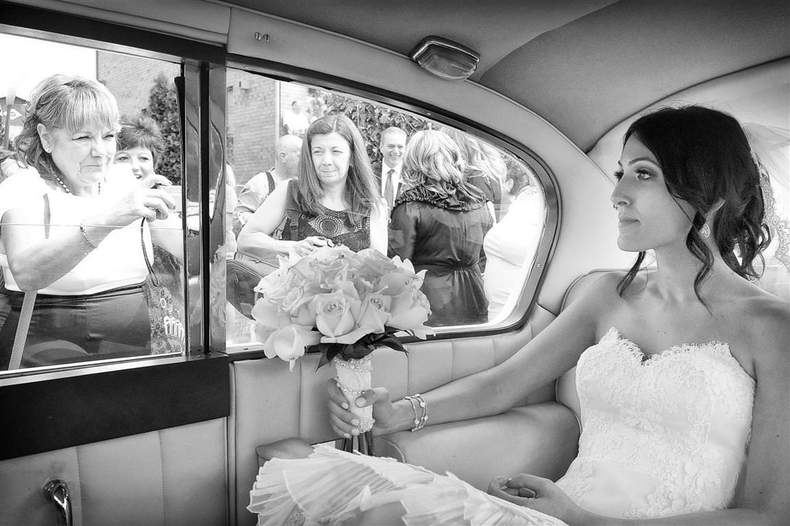 astonishing wedding bride in car guest taking photo black white wedding photo by lavimage montreal