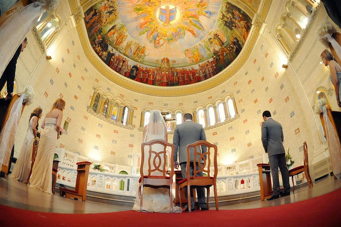 astonishing wedding ceremont couple bridesmaids best man artistic view with church dome ceiling colored photo by lavimage montreal