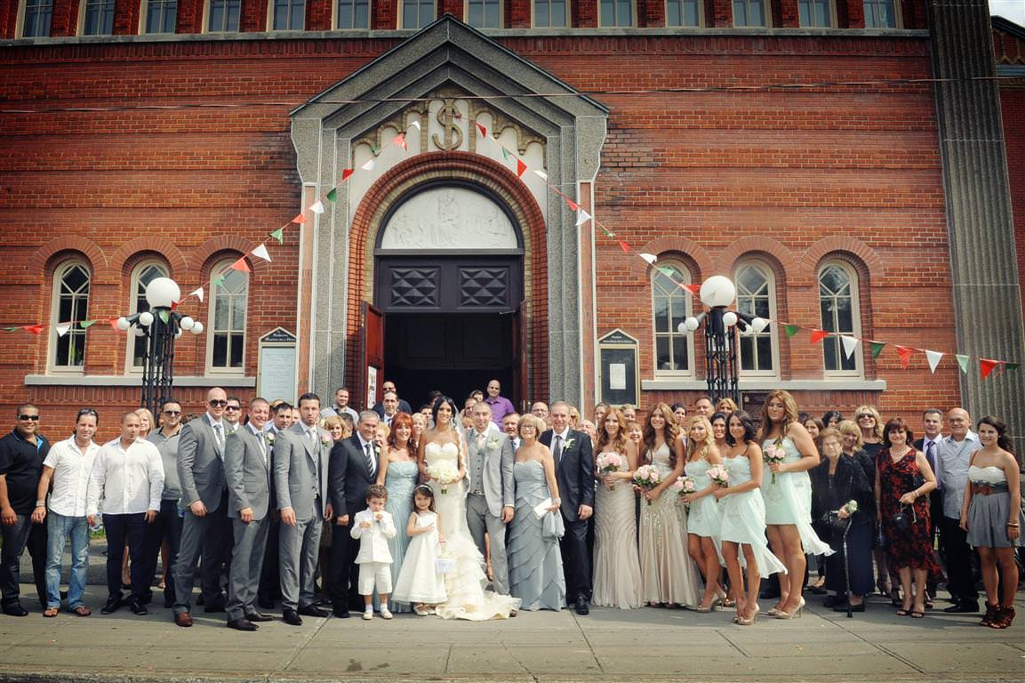 astonishing wedding colored group portrait bride groom parents best men bridesmaids guests  by lavimage montreal