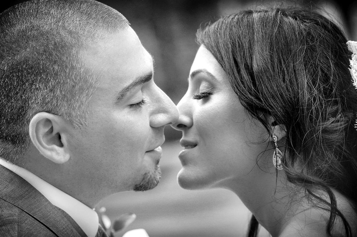 astonishing wedding couple together romantic kiss moment black white photo by lavimage montreal