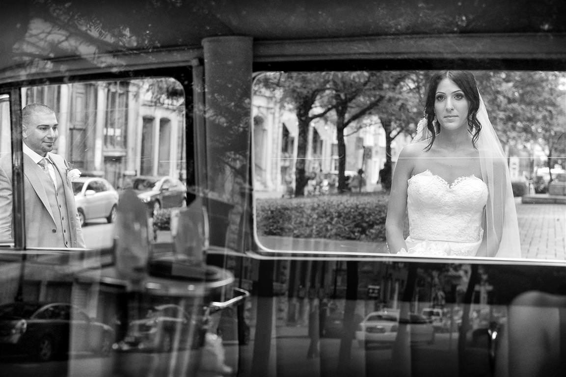 astonishing wedding couple together city walk artistic black white shot with reflection by lavimage montreal