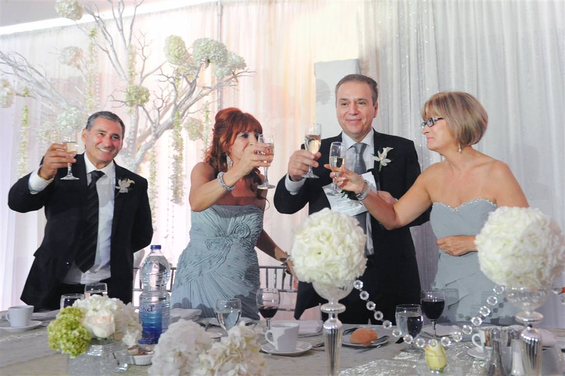 astonishing wedding reception parents toast together colored wedding photo by lavimage montreal