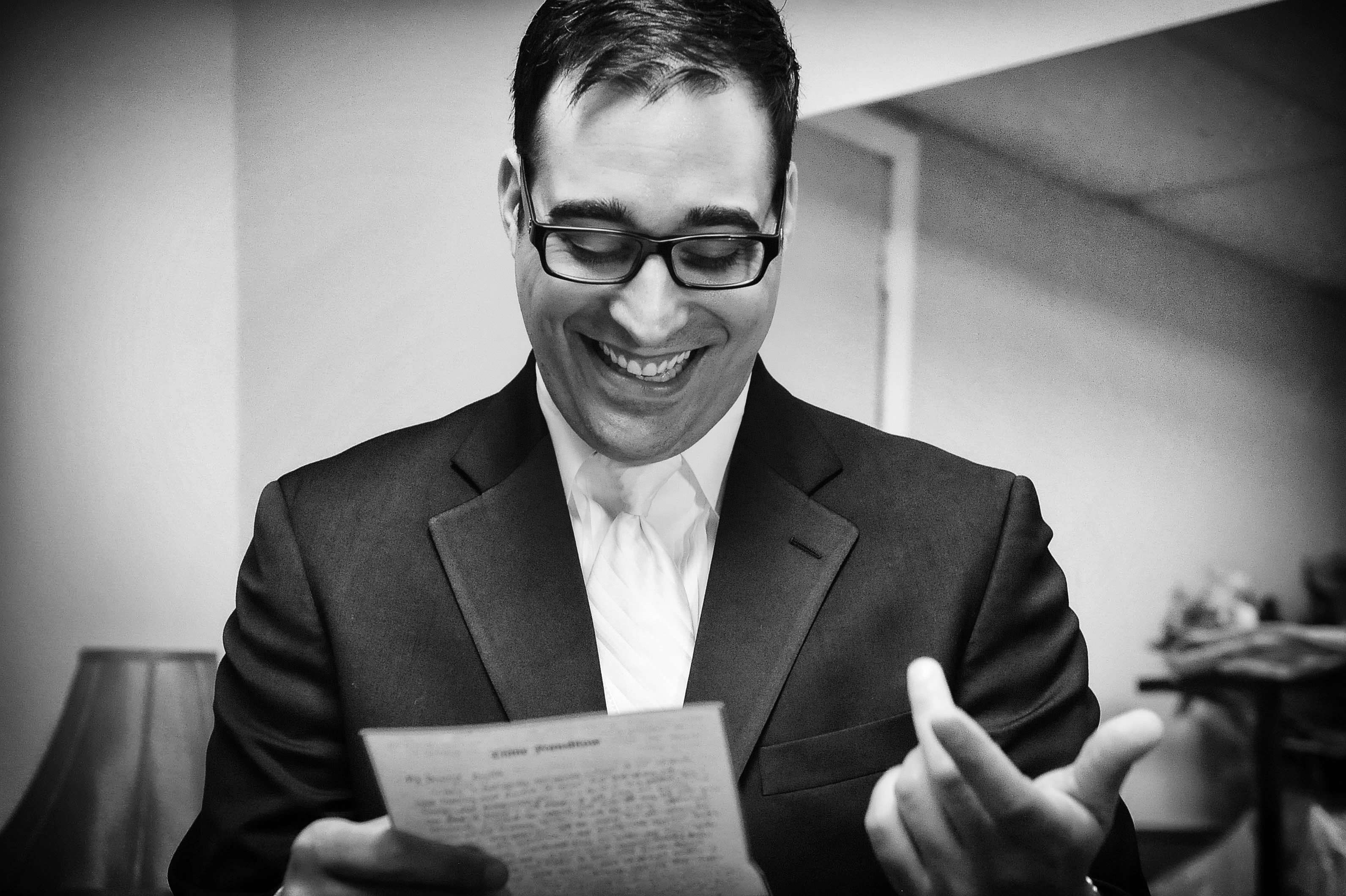 charming wedding getting ready groom memorizes speech black white wedding photo by lavimage montreal