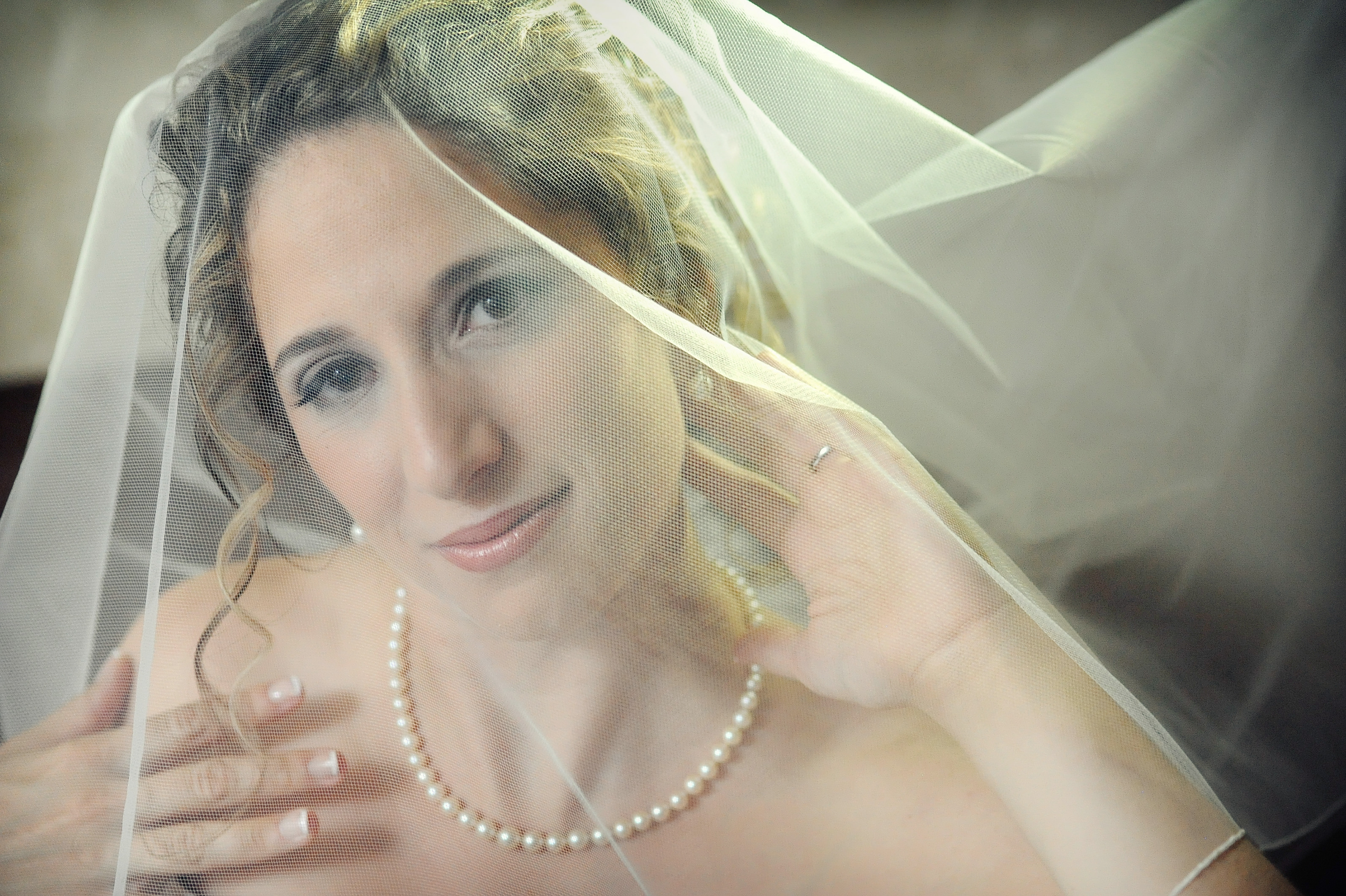 charming wedding bride's beauty portrait under veil colored wedding photo by lavimage montreal