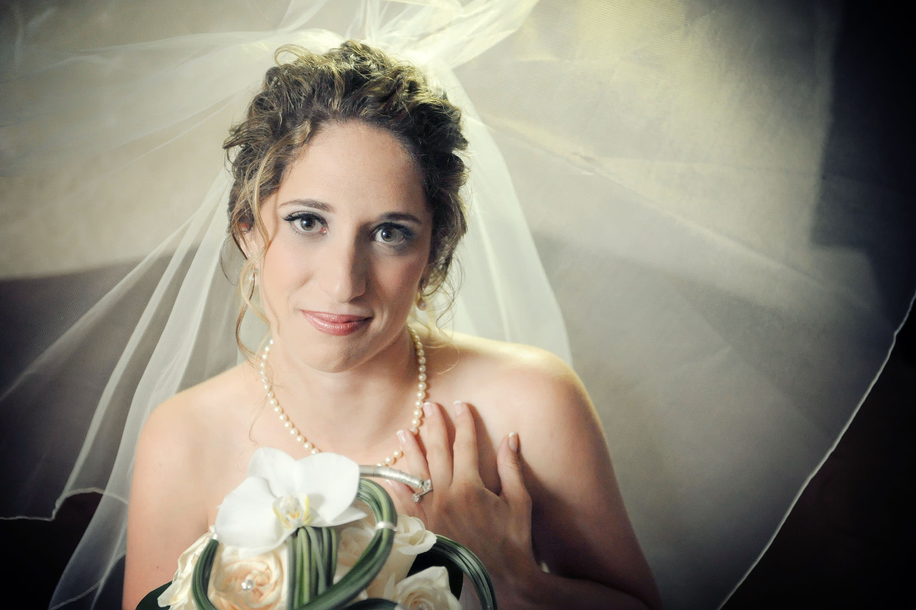 charming wedding bride's beauty portrait under veil with flowers colored wedding photo by lavimage montreal