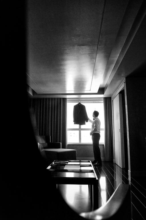 black white wedding photos getting ready groom checking costume by lavimage montreal