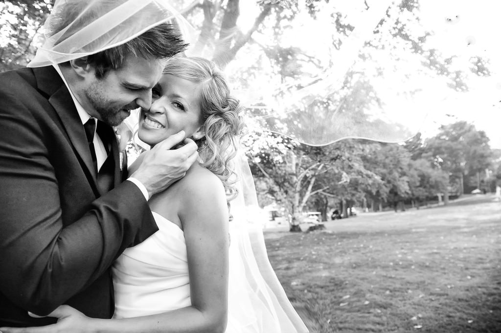 black white wedding photos couple together romantic kiss under veil by lavimage montreal