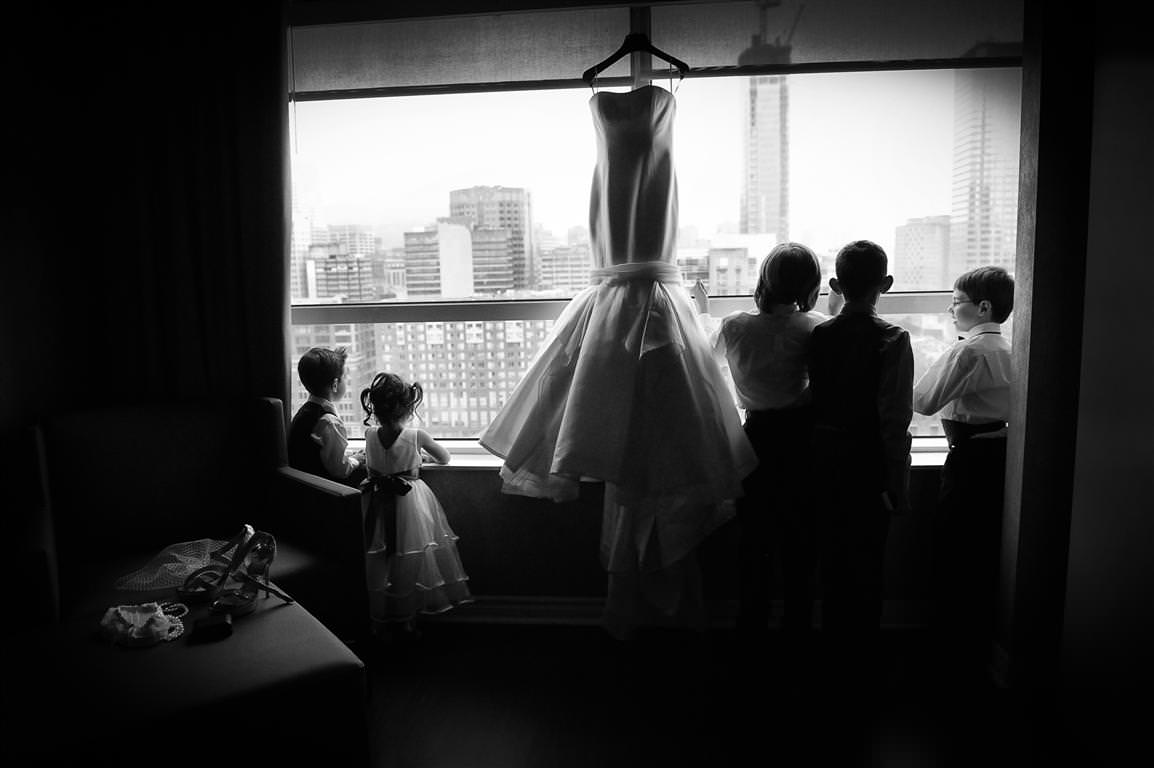 black white wedding photos kids looking window bride's dress by lavimage montreal at the Science centre Wedding