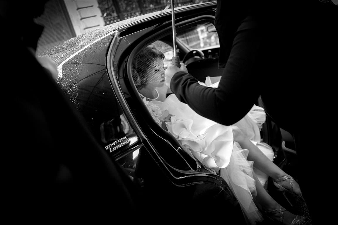 black white wedding photos bride car rain by lavimage montreal at the Science Centre Wedding