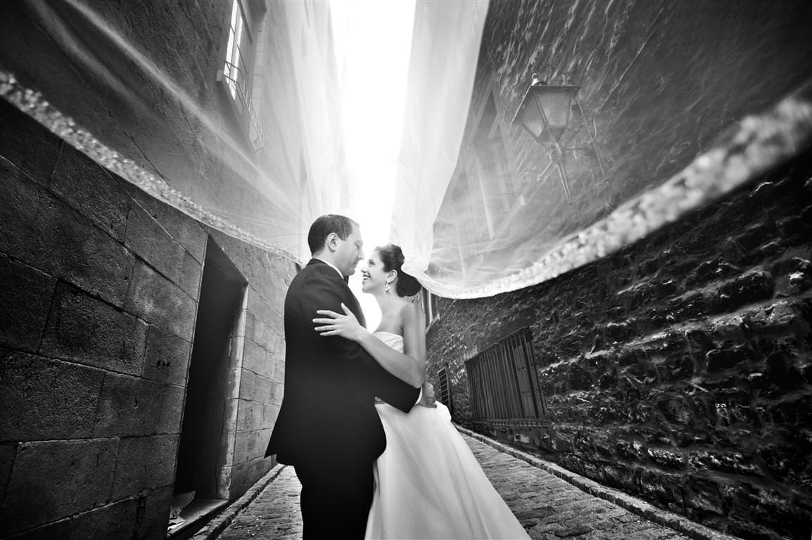 black and white wedding pictures couple together city walk romantic embrace by lavimage montreal