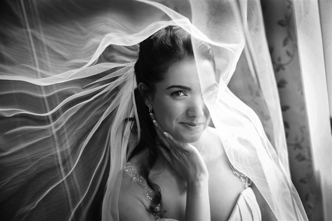 black white wedding photos getting ready bridal portrait mysterious book under veil by lavimage montreal