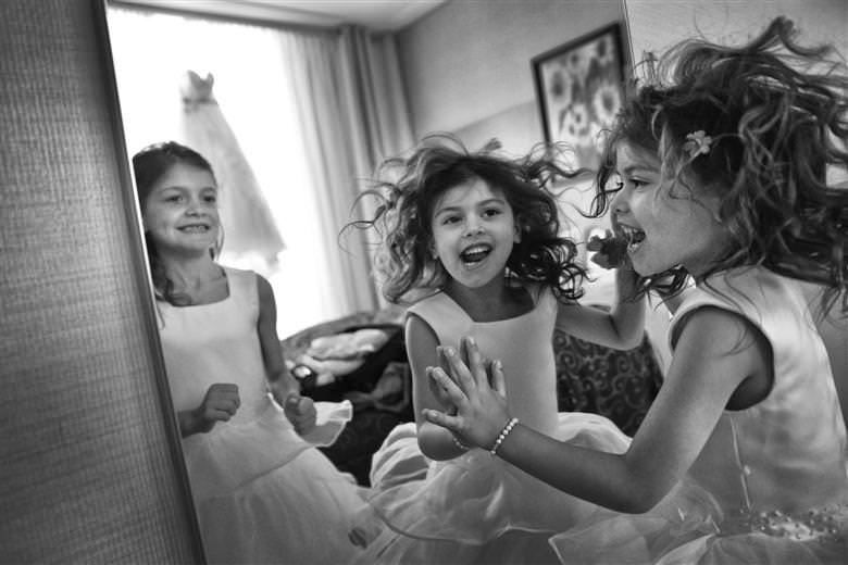 Kids playing the wedding dress in the background Award Winning pictures by La V image Montreal wedding photographer