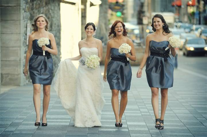 Bride walking with bridesmaids in the old port of Montreal Wedding at the Science Centre Montreal by La V image-Montreal wedding photographer