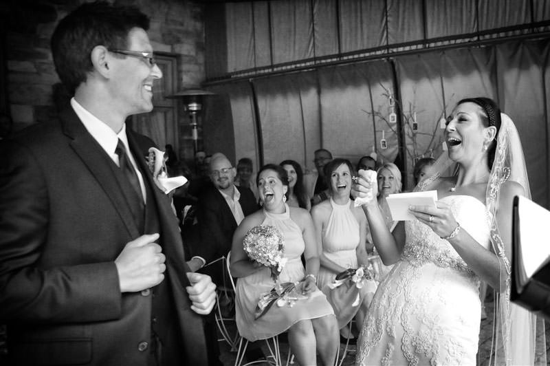 Bride laughing at the Wedding ceremony at the vineyard photographed by La V image-Montreal wedding photographer