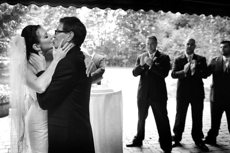 A kiss between the bride and the groom at the Wedding ceremony at the vineyard wedding photographed by La V image-Montreal wedding photographer