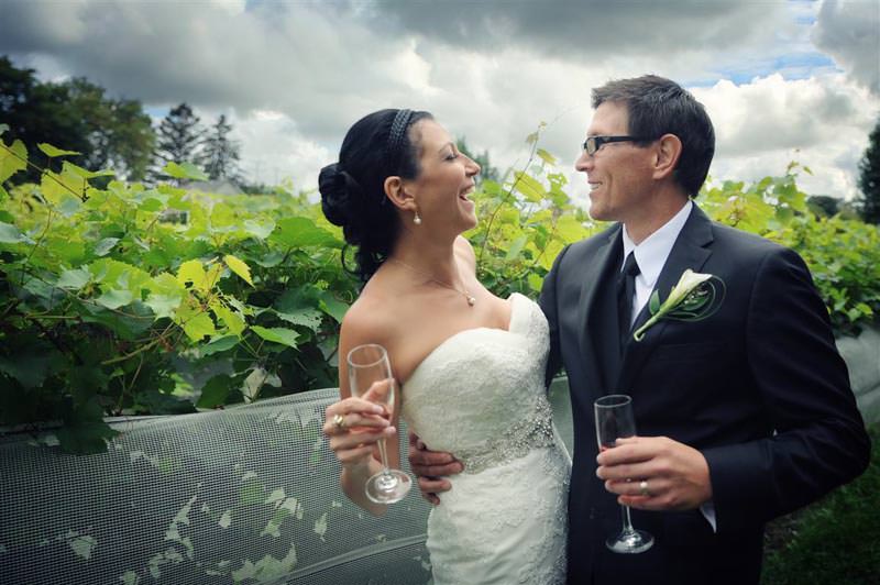 Romantic photo of bride and groom together with champaign at the vineyard wedding photographed by La V image-Montreal wedding photographer 