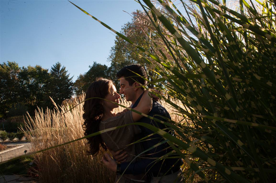 Couple in the grass Engagement session at the botanical garden of Montreal by la V image