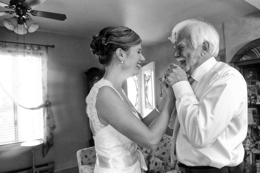 Parents at wedding-Father hold his daughters hands an intense emotional moment by la V image-Montreal wedding photographer