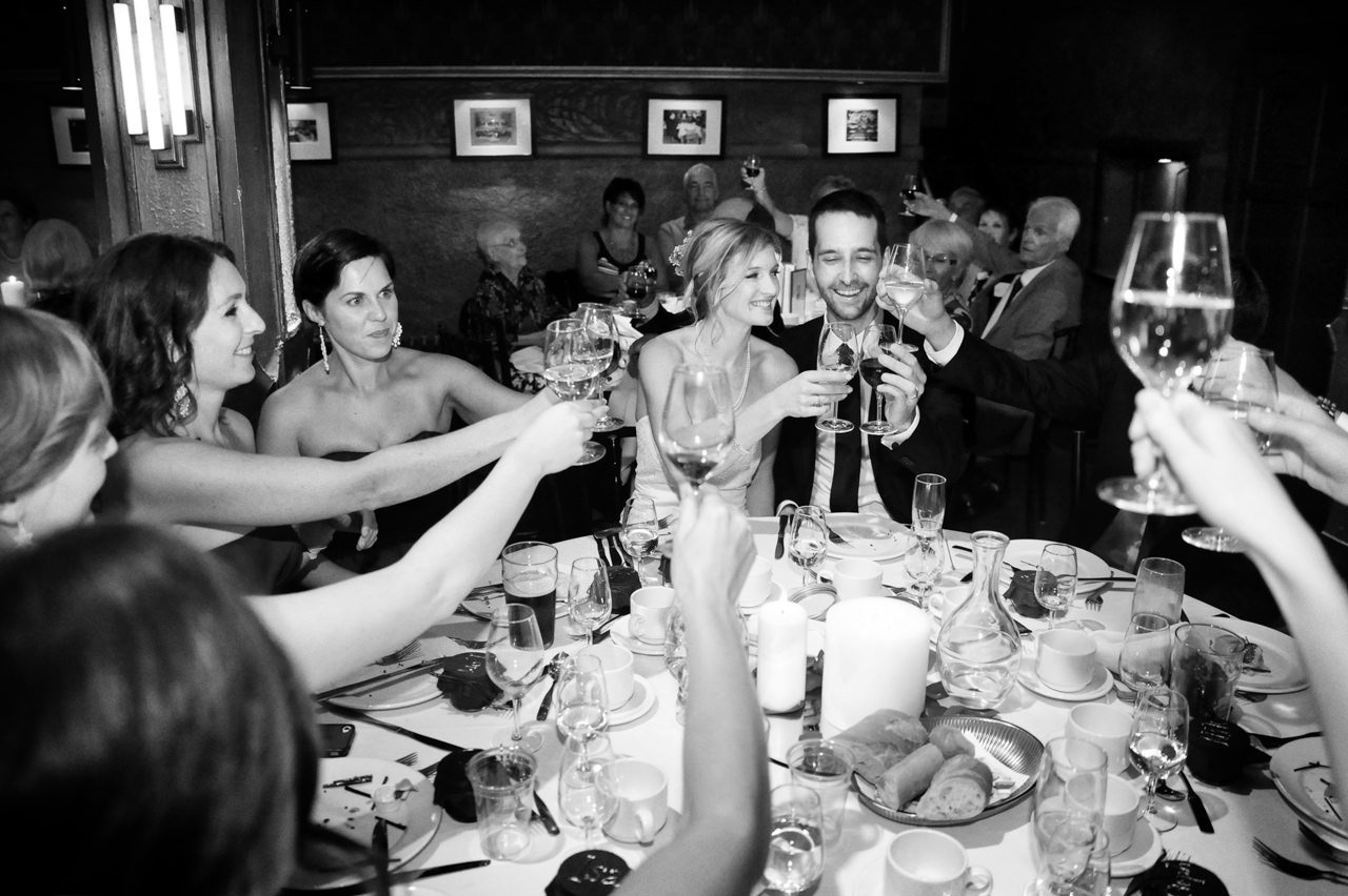 Wedding party Bride and groom toasting by la V image-Montreal wedding photographer